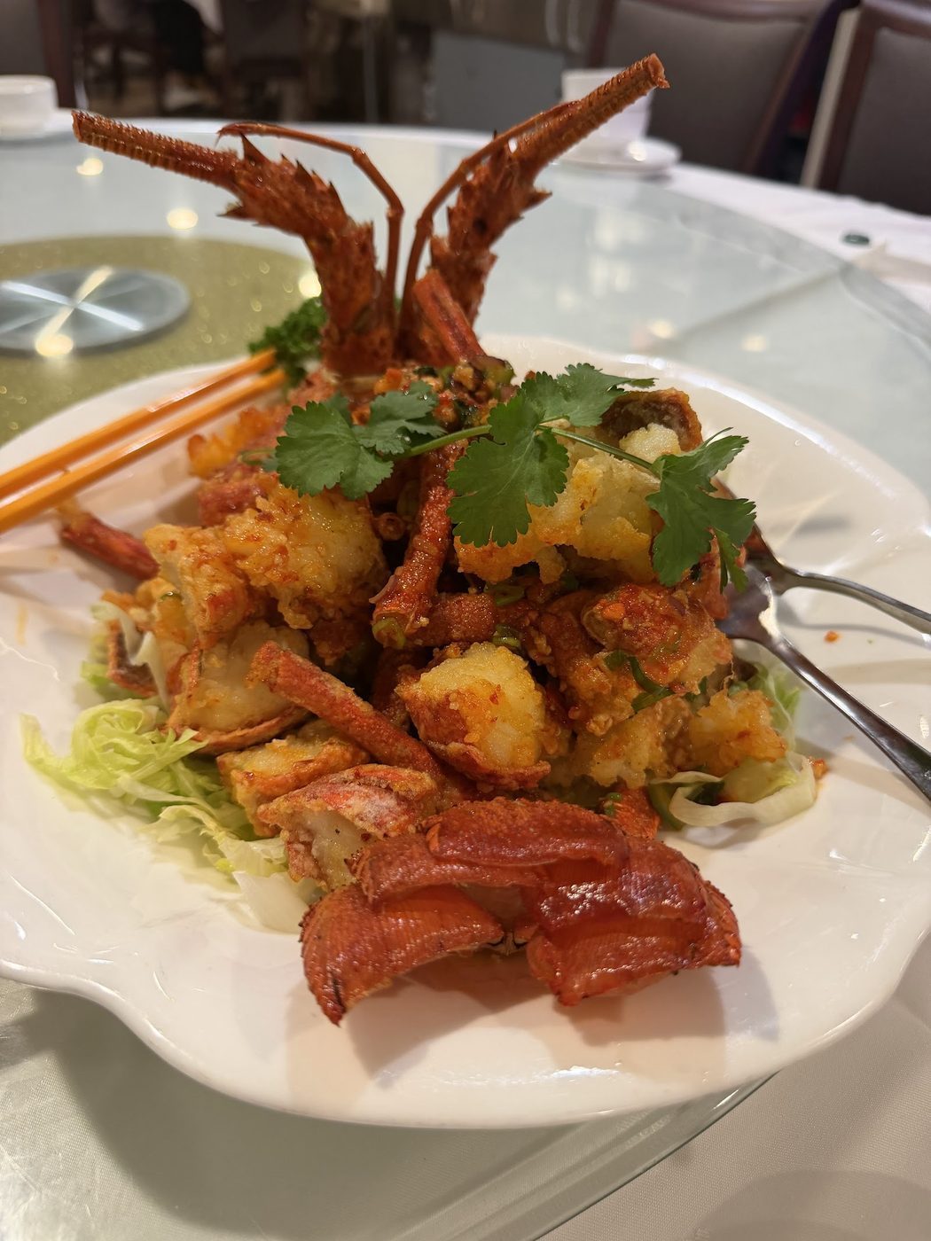 Fried seafood and prawns arranged on a shared plate